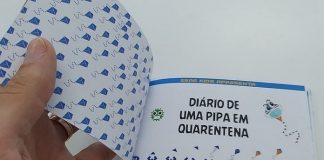 pessoa abre o livro "Diário de uma Pipa em Quarentena"