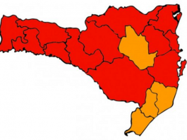 Matriz aponta 12 regiões em estado gravíssimo e quatro em nível grave para Covid-19 Desenho do mapa de Santa Catarina com 16 divisões de regiões, sendo quatro em cor laranja e dez em cor vermelha. O mapa representa a nova matriz de risco à Covid-19 do estado.