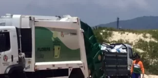 caminhões de lixo fazendo transbordo dentro do parque do santinho