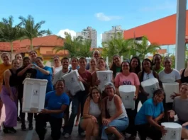 Educandário Santa Catarina recebe Certificação Lixo Zero Equipe do Educandário Santa Catarina com lixeiras usadas na separação de resíduos durante ações do programa Lixo Zero